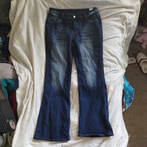 Bell bottom Flare partially faded jeans with patterned flap back pockets